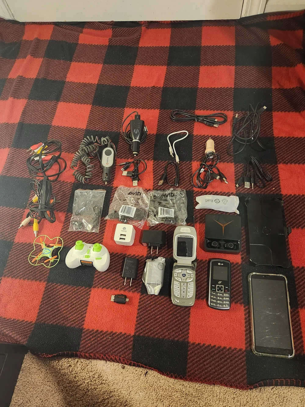 Elctronics Lot, Cellphones, Charging Cords, Remotes, And More